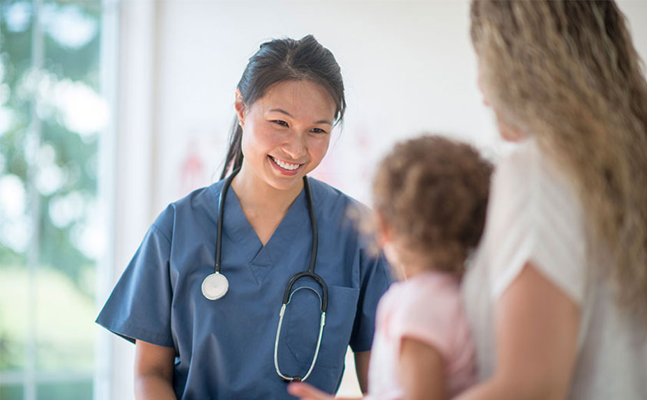 Nurse speaking to a mother and child