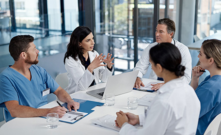 health professionals meeting at a table