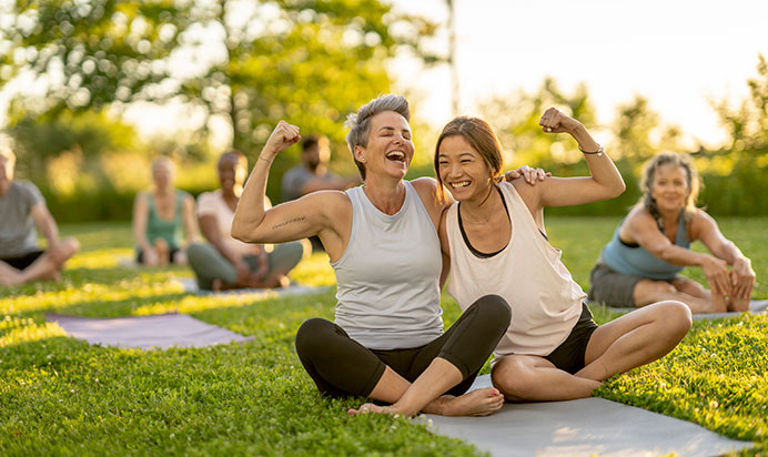 Sting women doing outdoor yoga